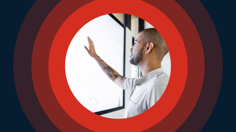 Man touching a white board