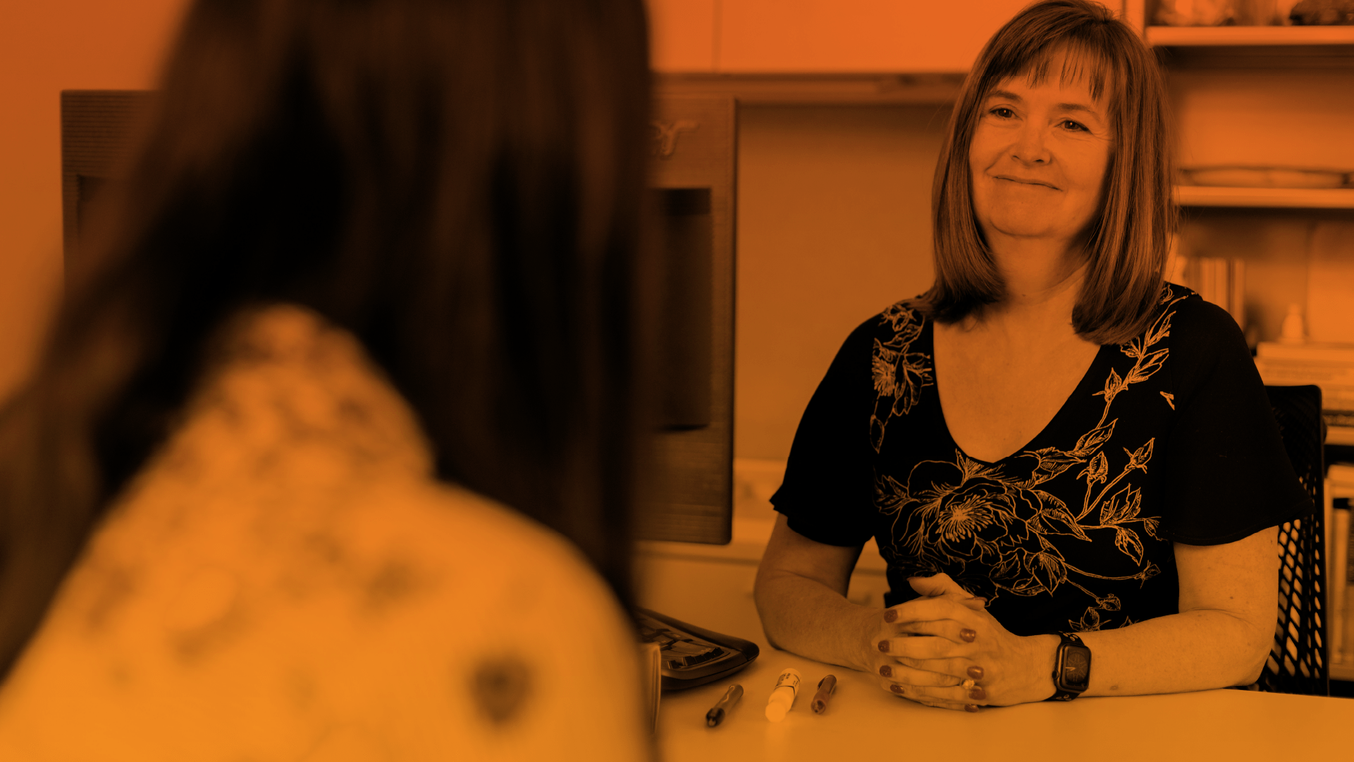 Two women talking with each other