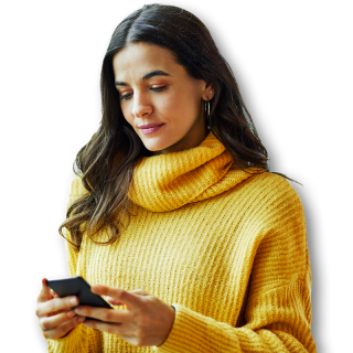 Woman in yellow sweater looking at her phone