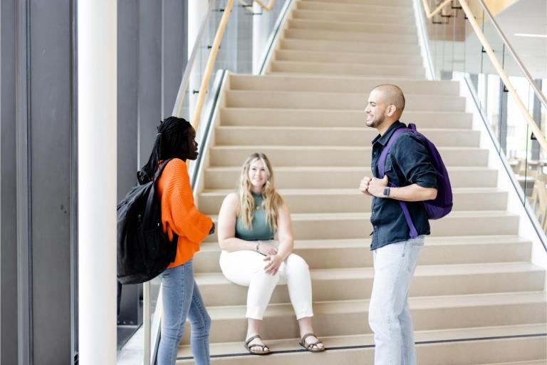 Students talking near steps